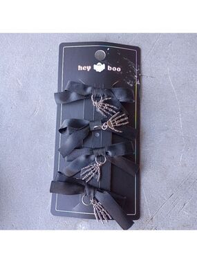 2/$10  4 Piece Black Bow Set With Skeleton Hand Charms